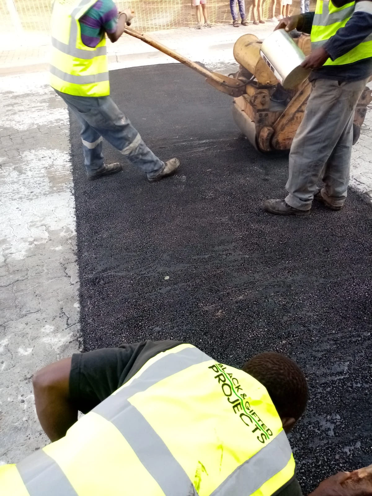 Asphalt patch compaction by the BG Projects crew